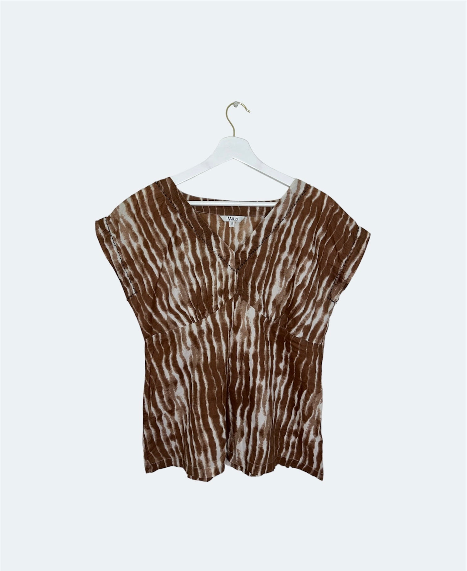 front of brown and white vintage top