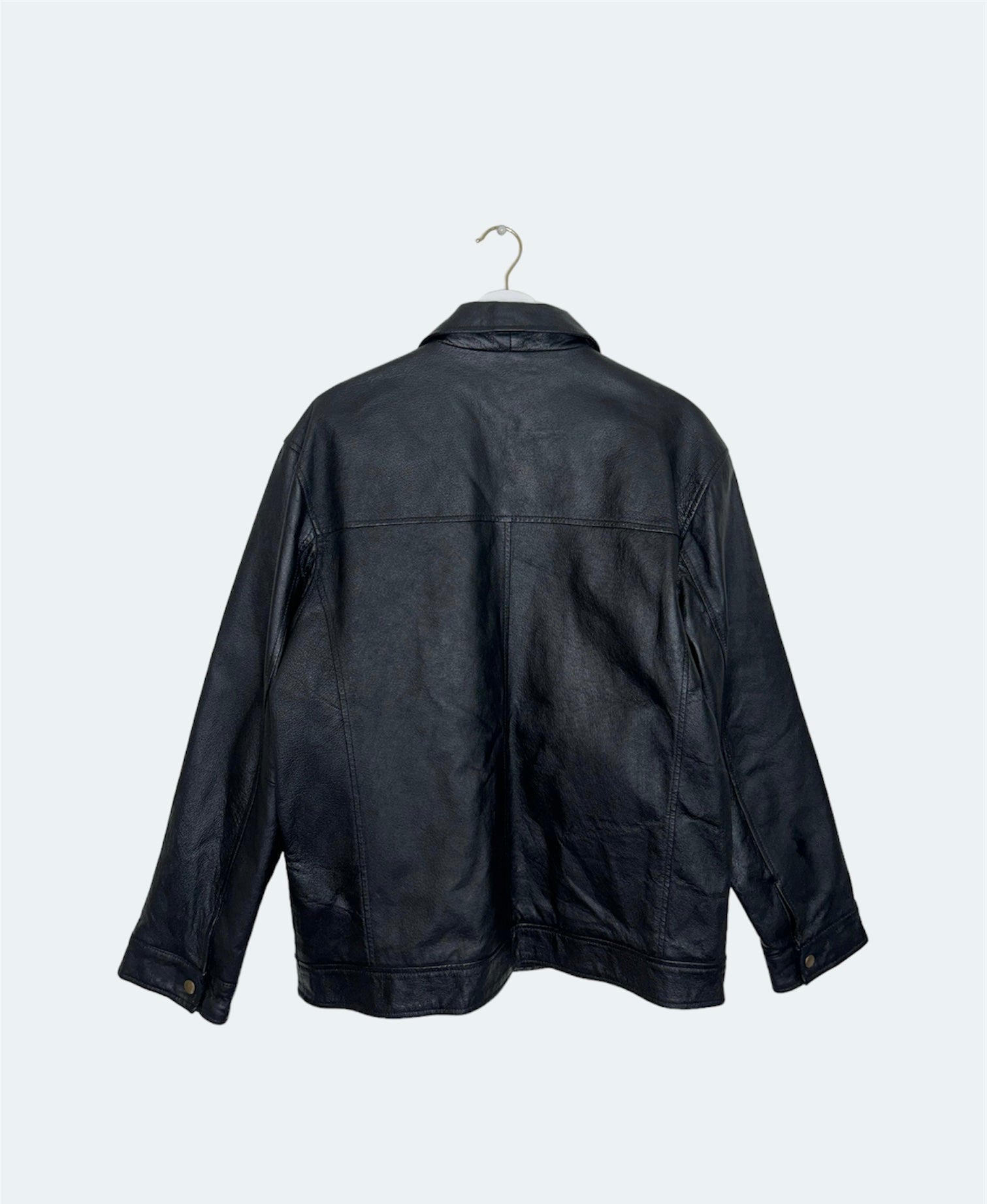 back of black leather vintage bomber jacket 