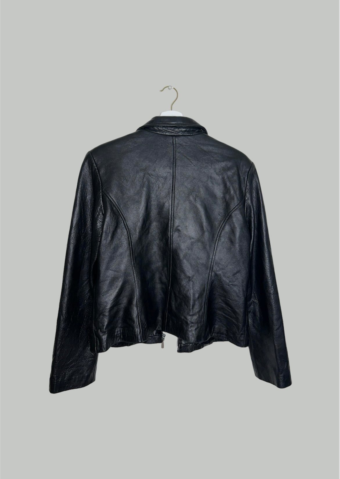 back of a black leather bomber jacket 