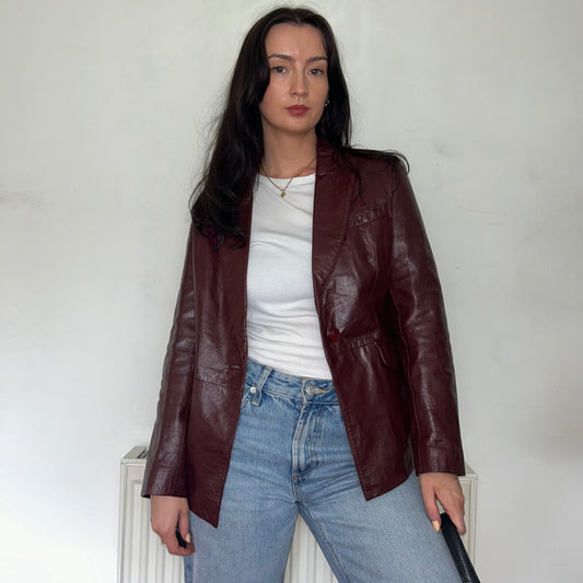 burgundy vintage leather jacket shown  on a model