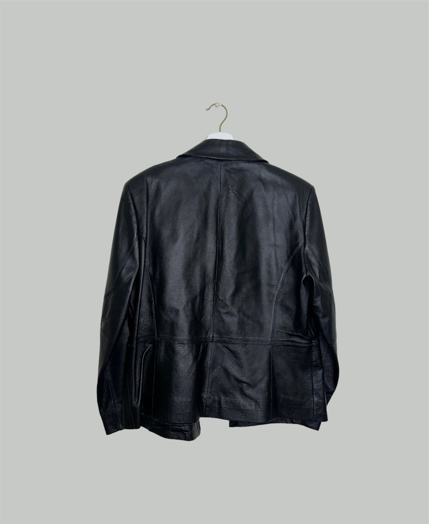 back of a black zip up bomber jacket