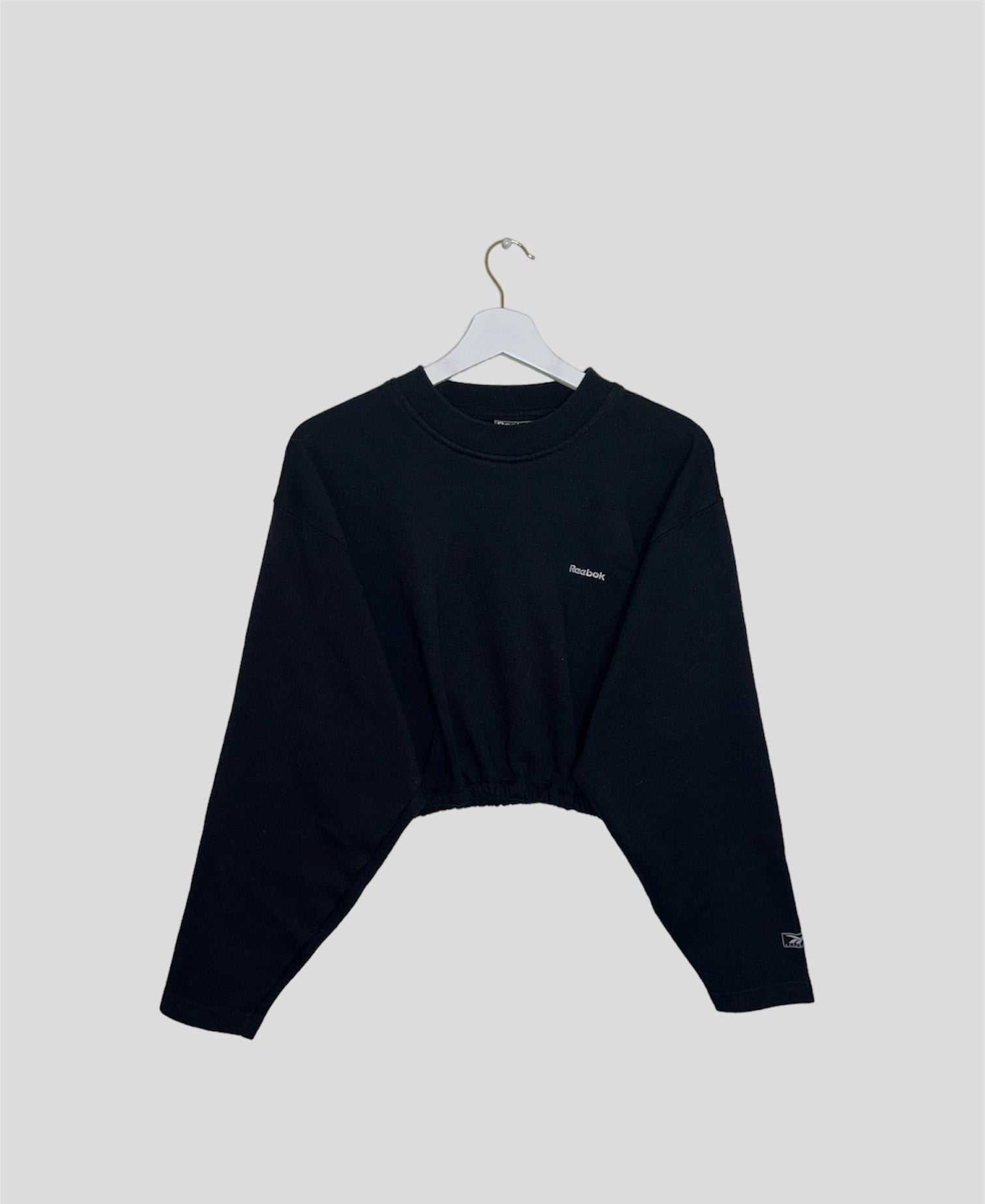 black cropped sweatshirt with white reebok logo