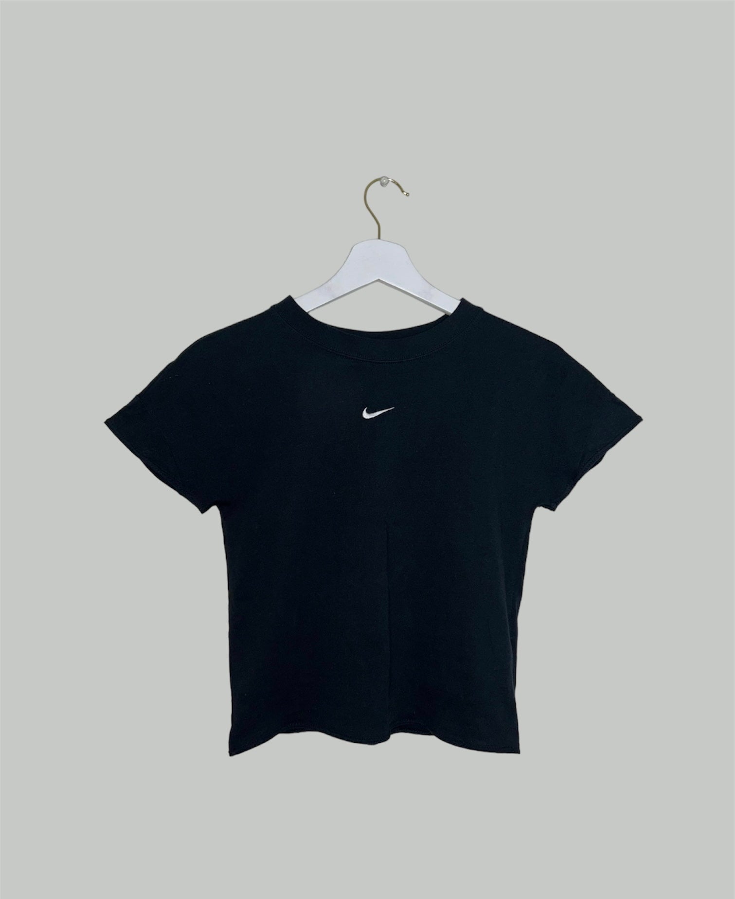 black short sleeve crop top with white nike swoosh logo