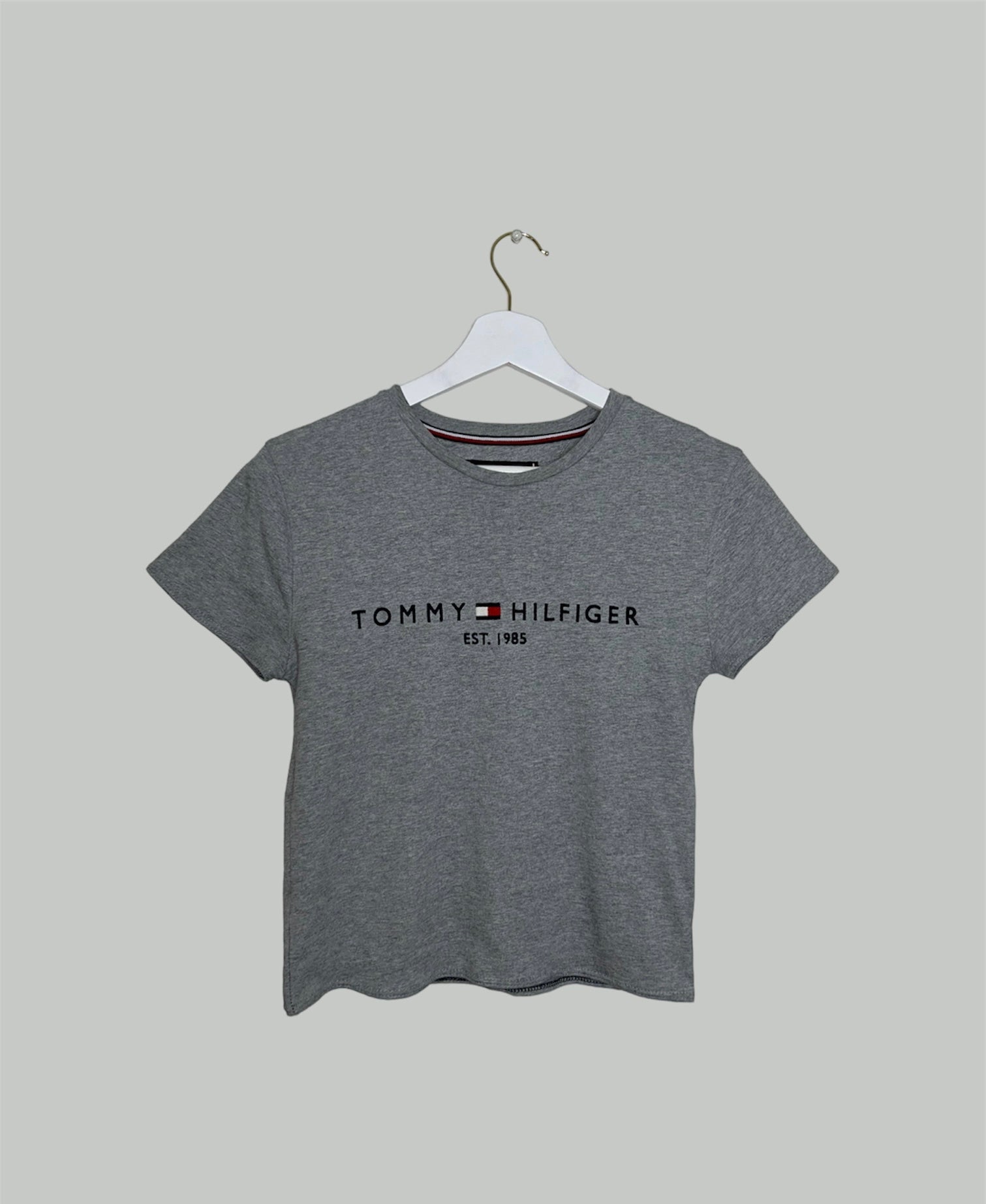 grey short sleeve crop top with black tommy hilfiger logo