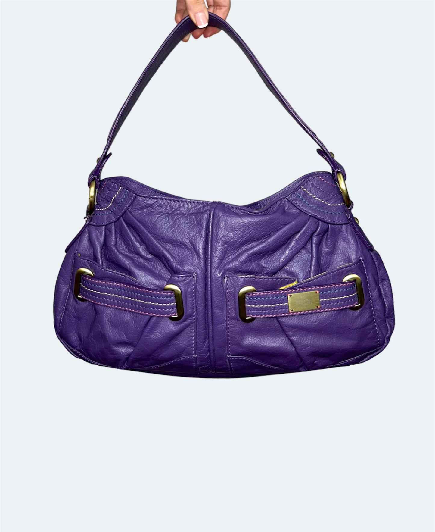 front of purple vintage leather shoulder bag
