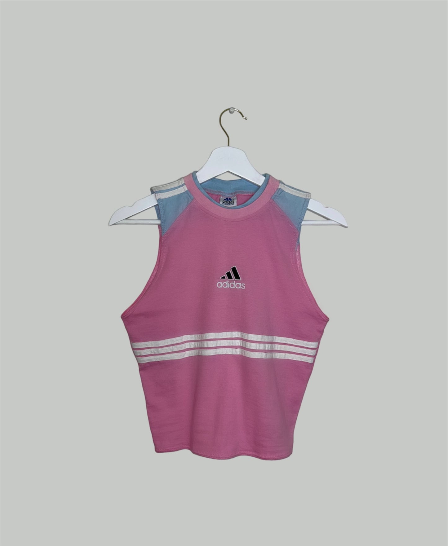 pink sleeveless crop top with black and white adidas logo