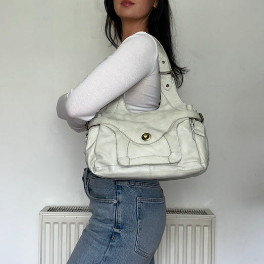 white leather shoulder bag shown on a  models shoulder
