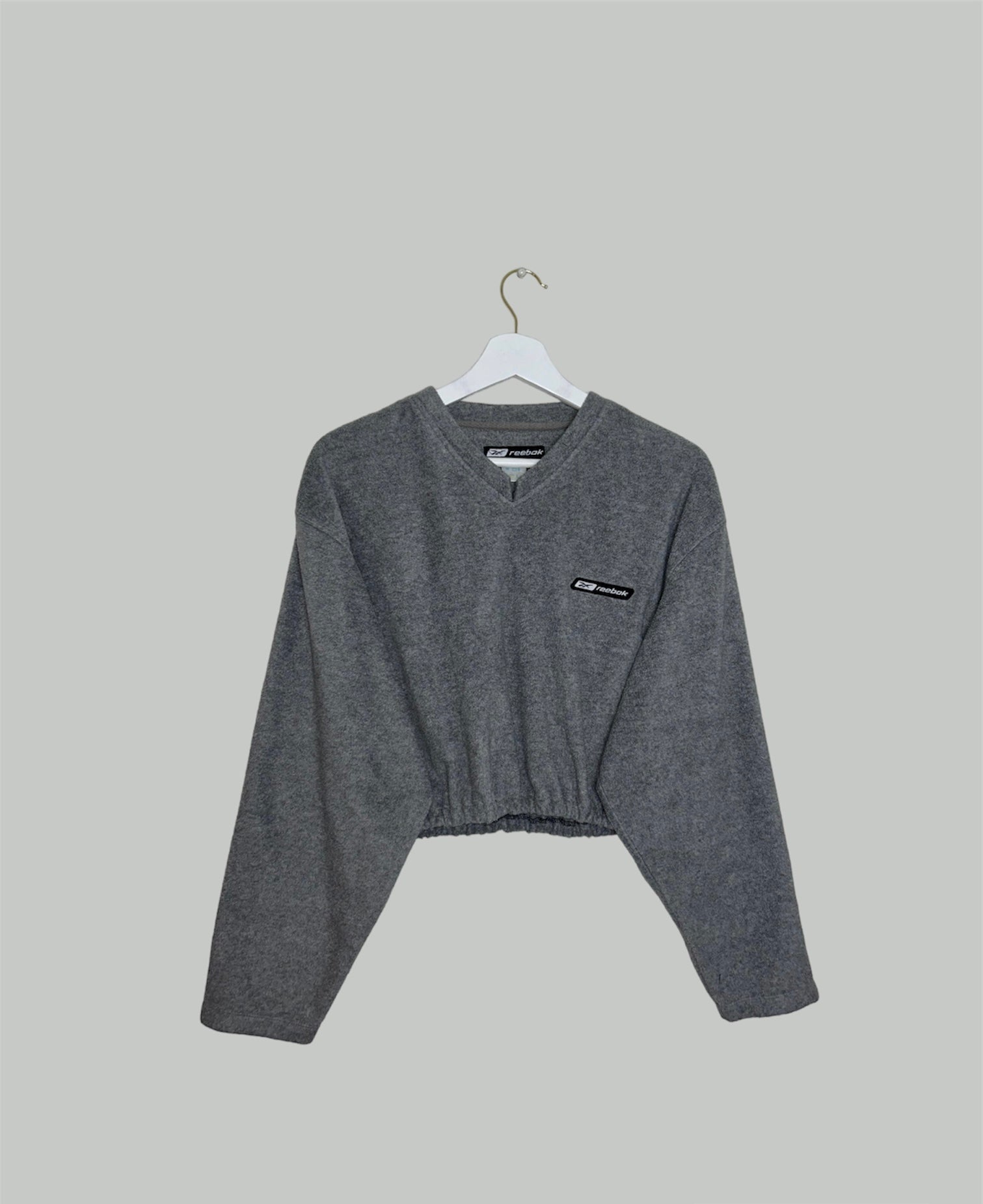 grey cropped sweatshirt with reebok logo