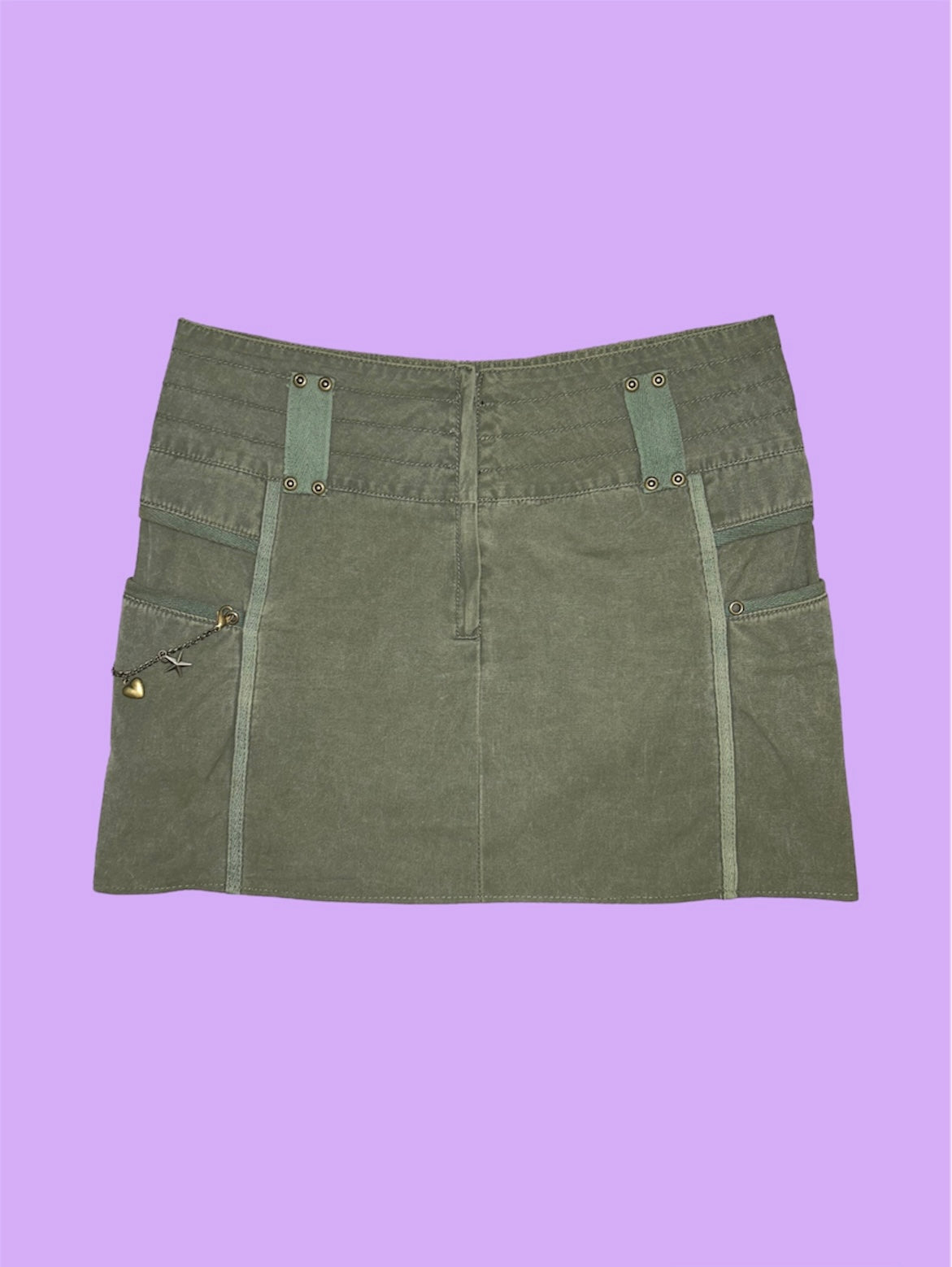 khaki mini cargo skirt shown on a lilac background