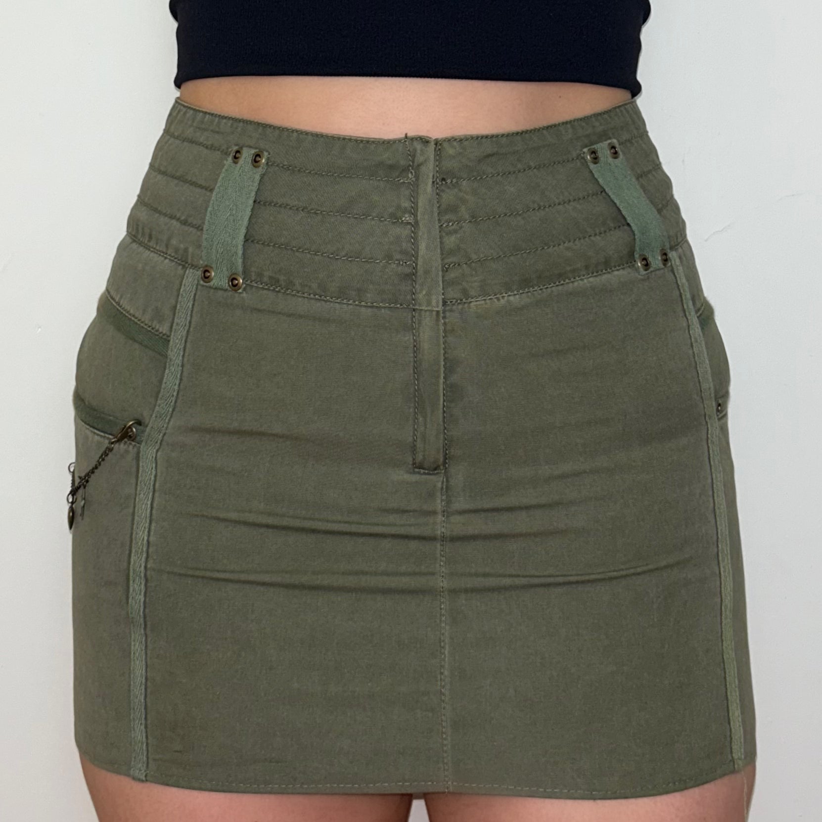 close up of khaki mini cargo skirt shown on a model