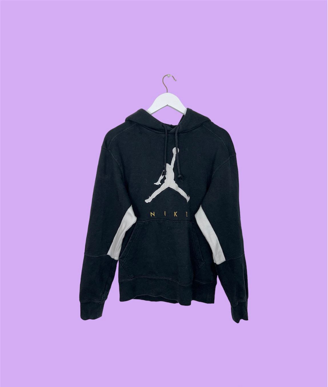 black hoodie with nike jordan logo shown on a lilac background