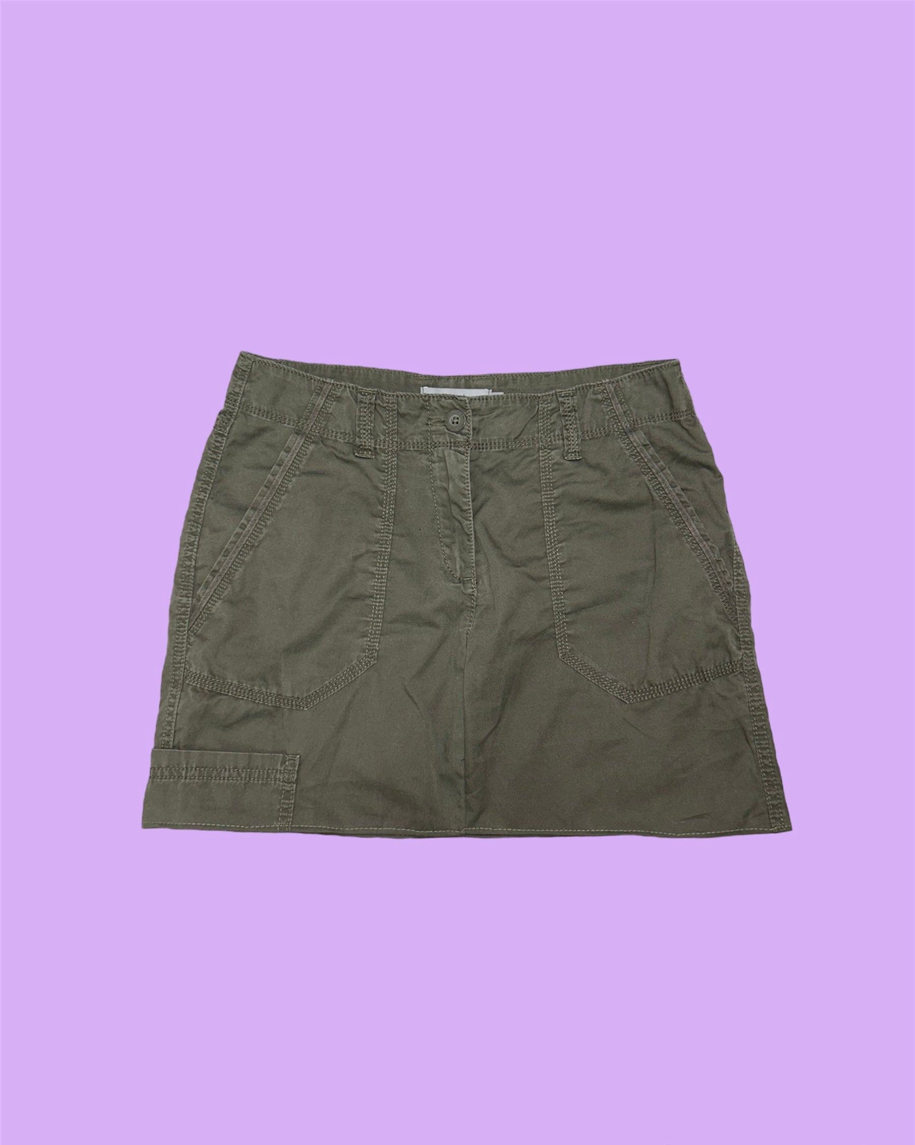 khaki brown cargo mini skirt shown on a lilac background