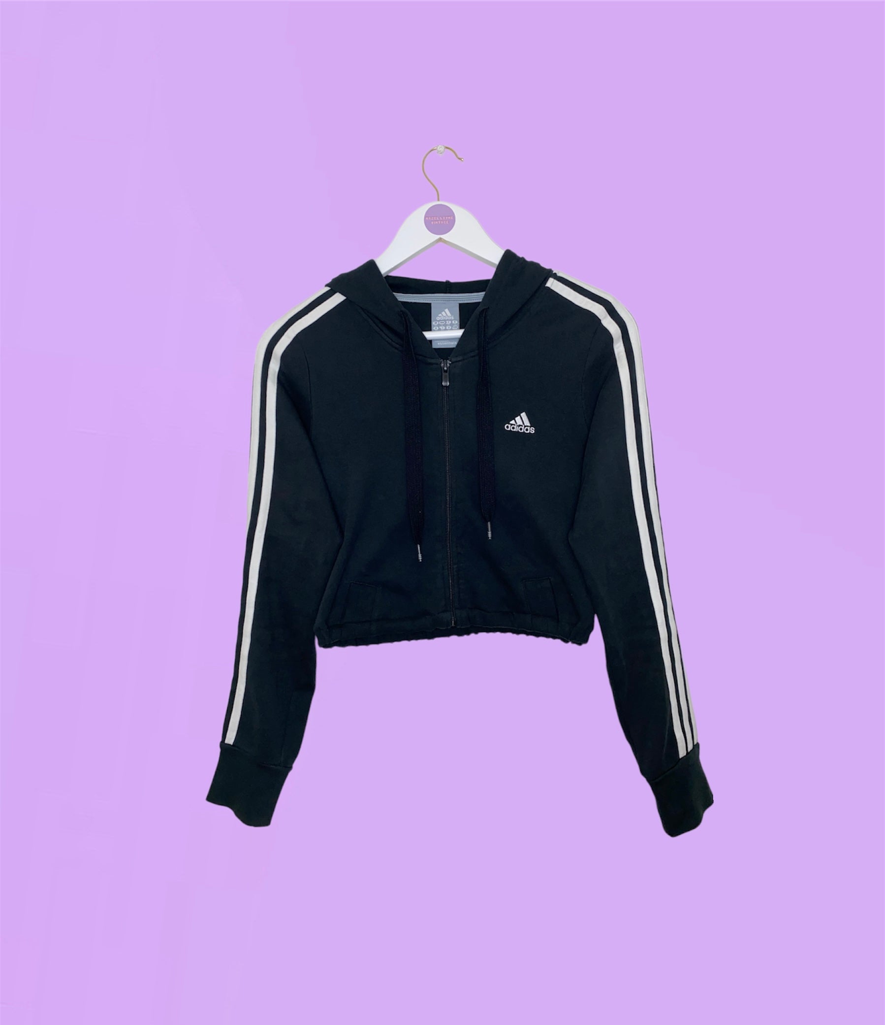 black 1/4 zip cropped hoodie shown on a lilac background