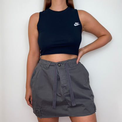 grey mini cargo skirt shown on a model wearing a black crop top