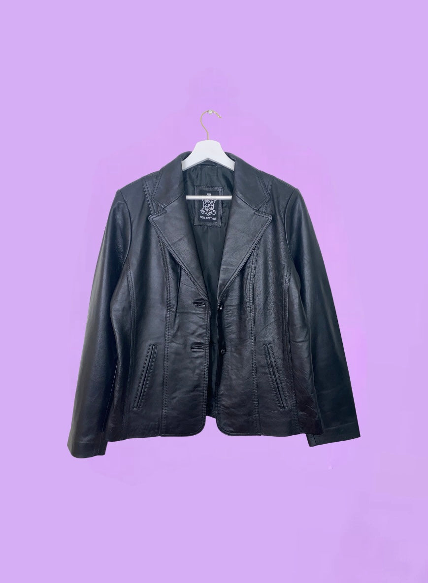 black real leather blazer jacket shown on a lilac background