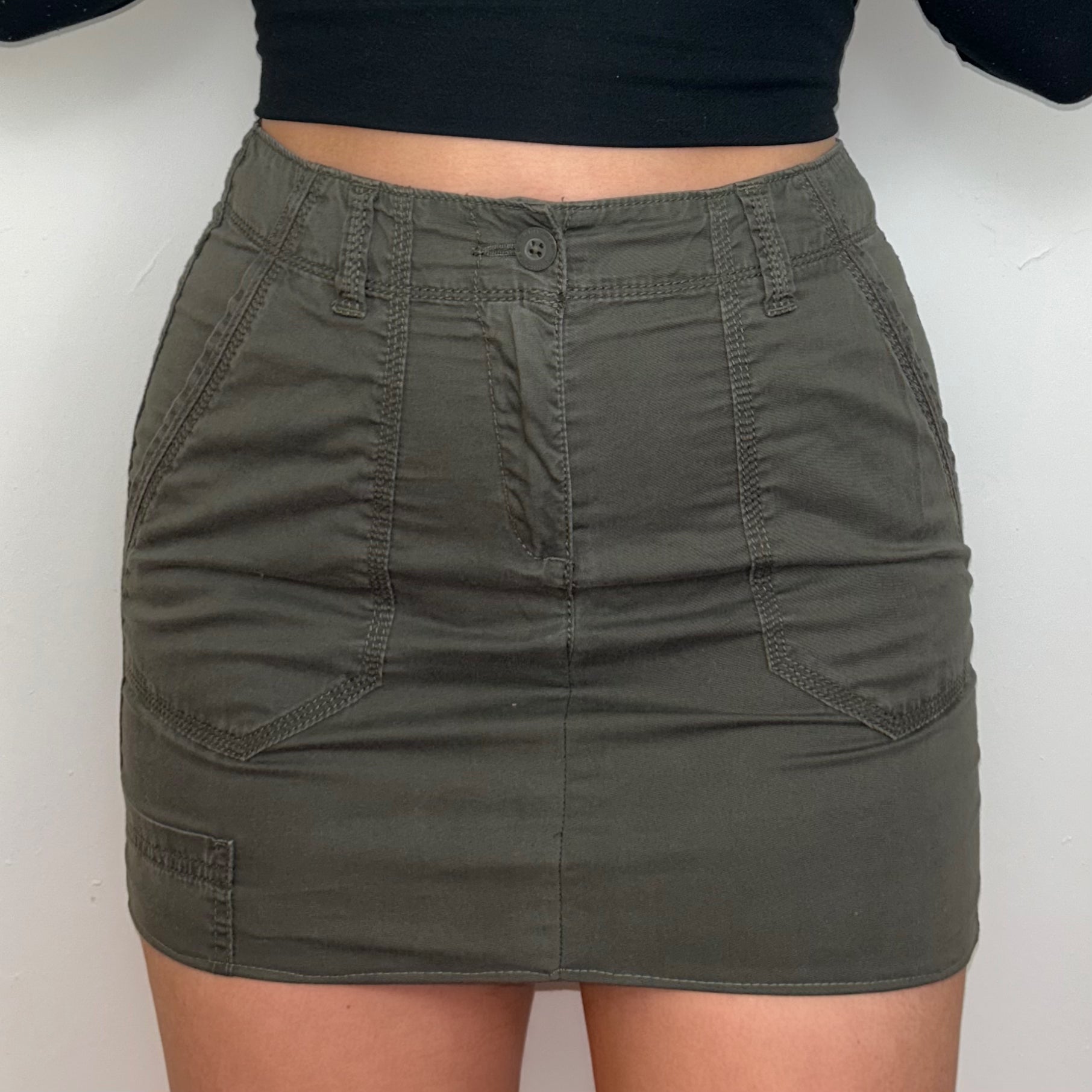 khaki brown cargo mini skirt shown on a model
